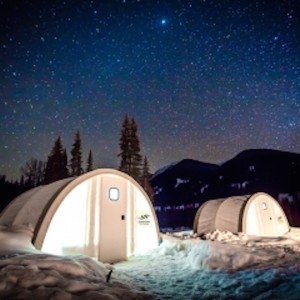 quonset huts at night under stars