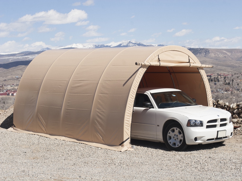 Tension fabric carport with car
