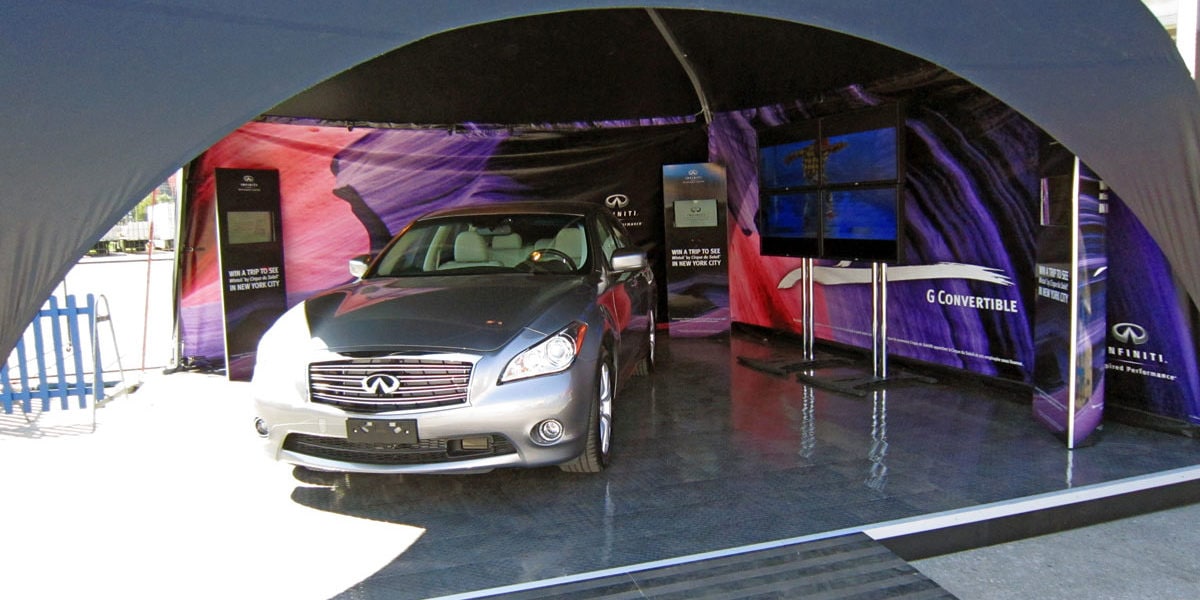 Infinity car under a branded canopy at car dealership