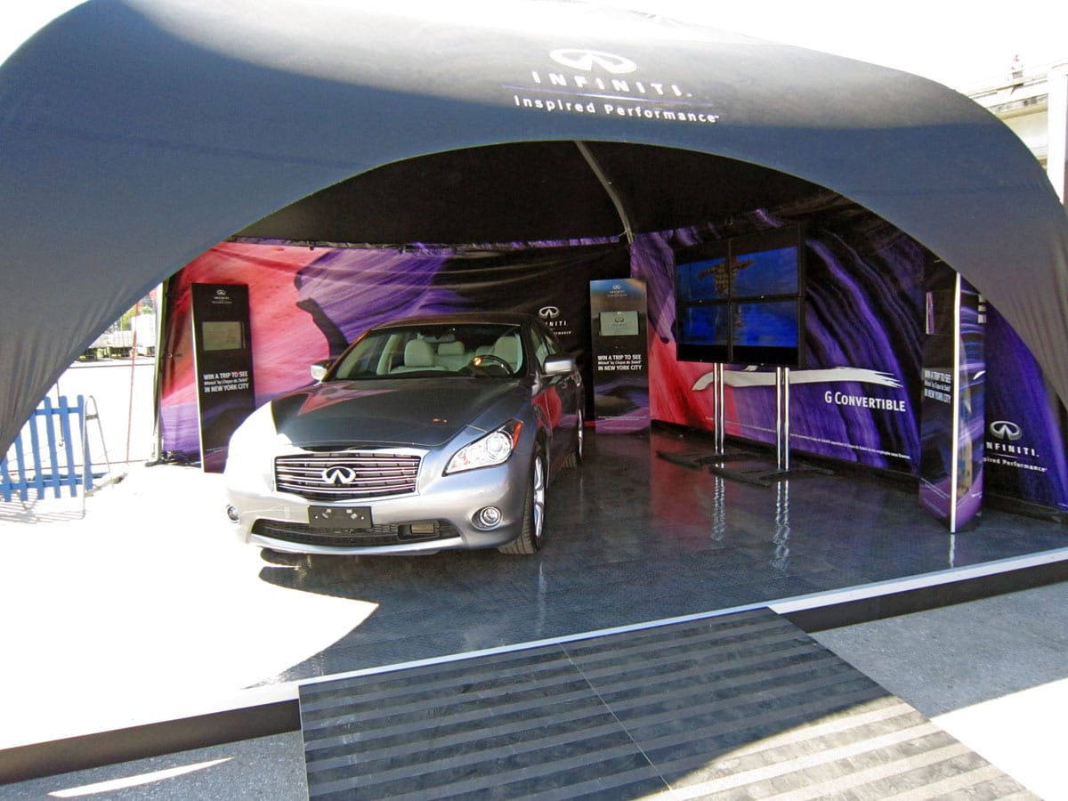 Infinity car under a branded canopy at car dealership