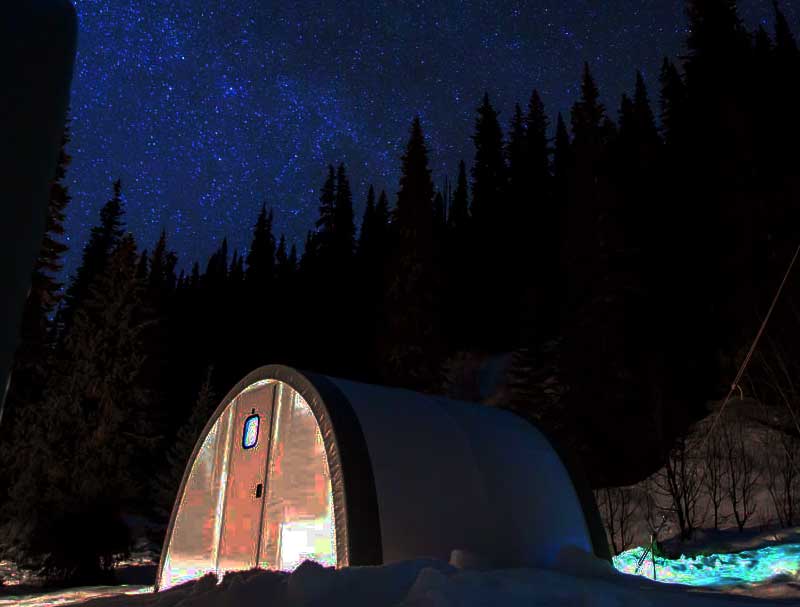 lite up camp with starry sky